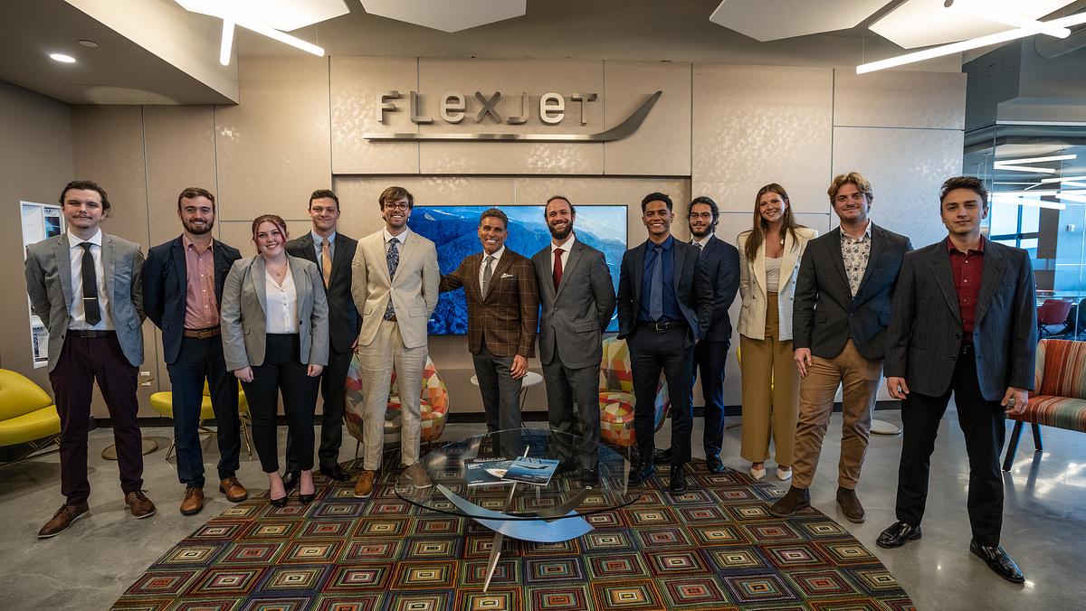 An expanded Flexjet Innovation and Career Center opening at Embry-Riddle’s Research Park will introduce students to opportunities in business aviation — including Flexjet’s plan to hire 350 pilots and 400 aviation professionals this year. From left: Flexjet staff and interns: Alex Hendrik, Will Edwards, Keely Mashburn, Cameron Langone, Hunter D. Gardner, Flexjet Chairman Kenn Ricci, Flexjet Innovation Center Manager Michael Campobasso, Collins Maude, Benigno Digon IV, Emily Connearney, Westin Pellicer and Zack Hagerty pose with members of Embry-Riddle’s Research Park.