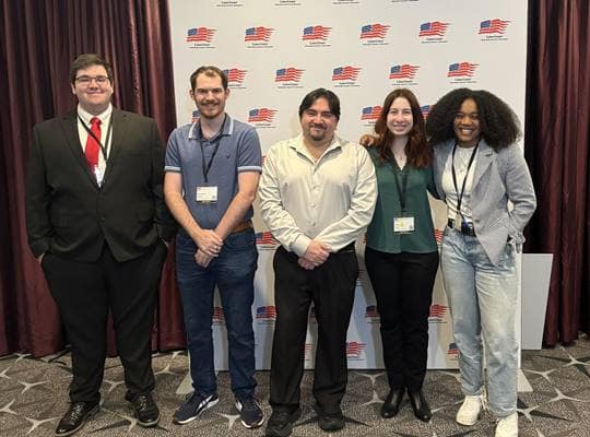Dr. Omar Ochoa and four students from Embry-Riddle's Daytona Beach Campus attended the CyberCorps job fair and networking event. Pictured from left to right are Caleb Hall, John-Patrick Mueller, Ochoa, Sofia Guida and Calla Robison .