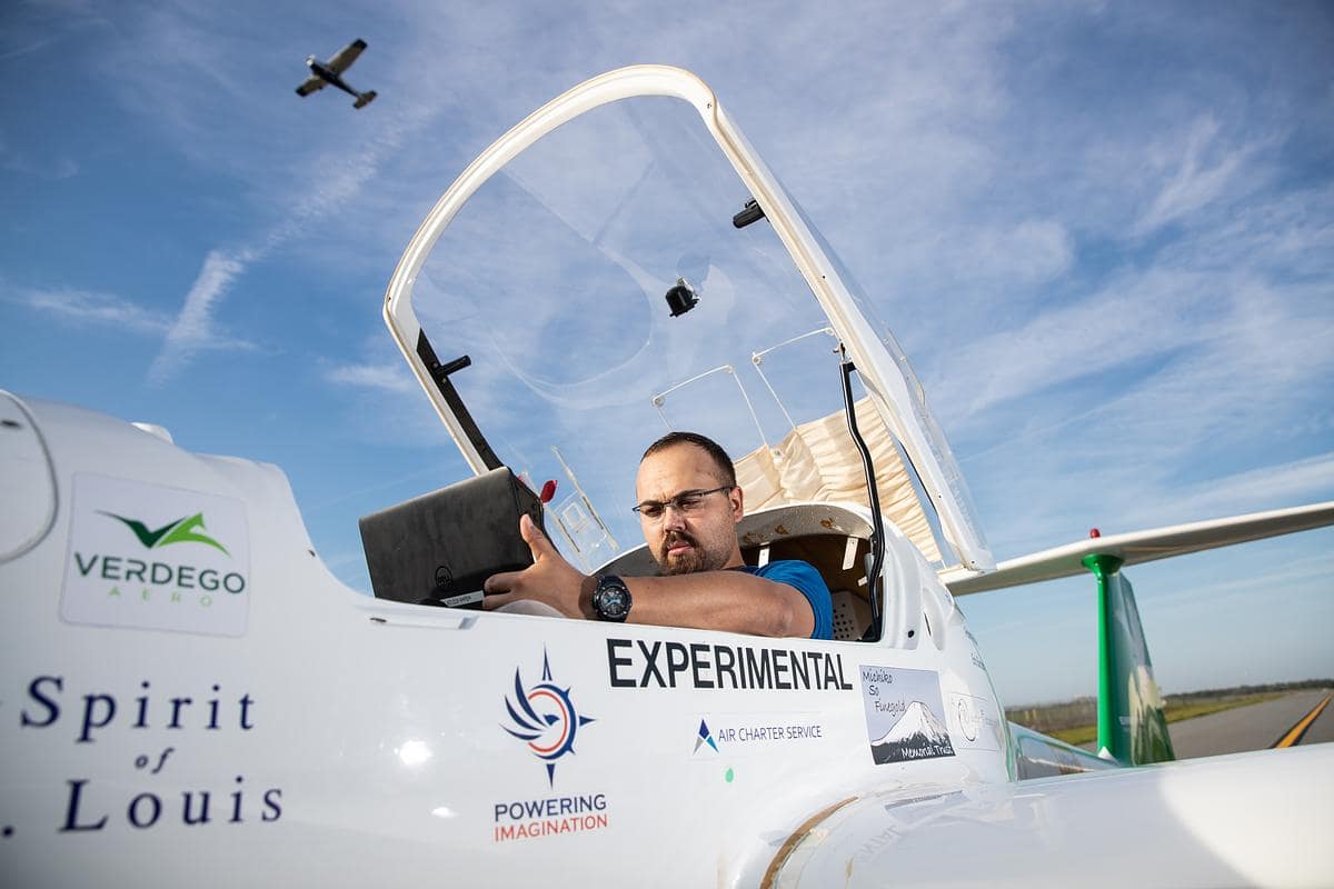 Drs. Sandra Boetcher and Mark Ricklick, standing in front of an aircraft turbine, received a $450,000 NSF grant to offer a student research collaboration with Brazilian colleagues on heat management of electric aircraft.