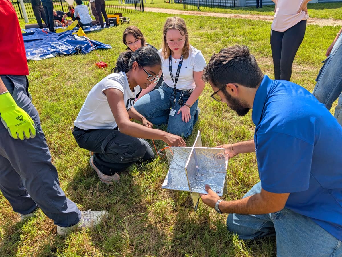 Embry-Riddle student Whitney Melick was selected to attend the four-day Space Trek Academy, sponsored by NASA Florida Space Grant Consortium and held at the Center for Space Education at Kennedy Space Center Visitor Complex. Here, Melick (center with lanyard) works with her teammates to successfully launch a weather balloon.
