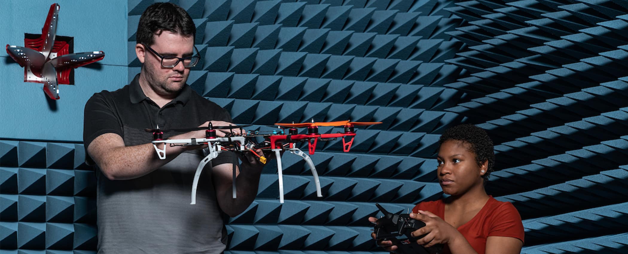 Students work with a drone in the MicaPlex.